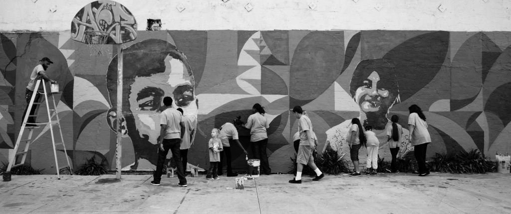 community members painting a mural
